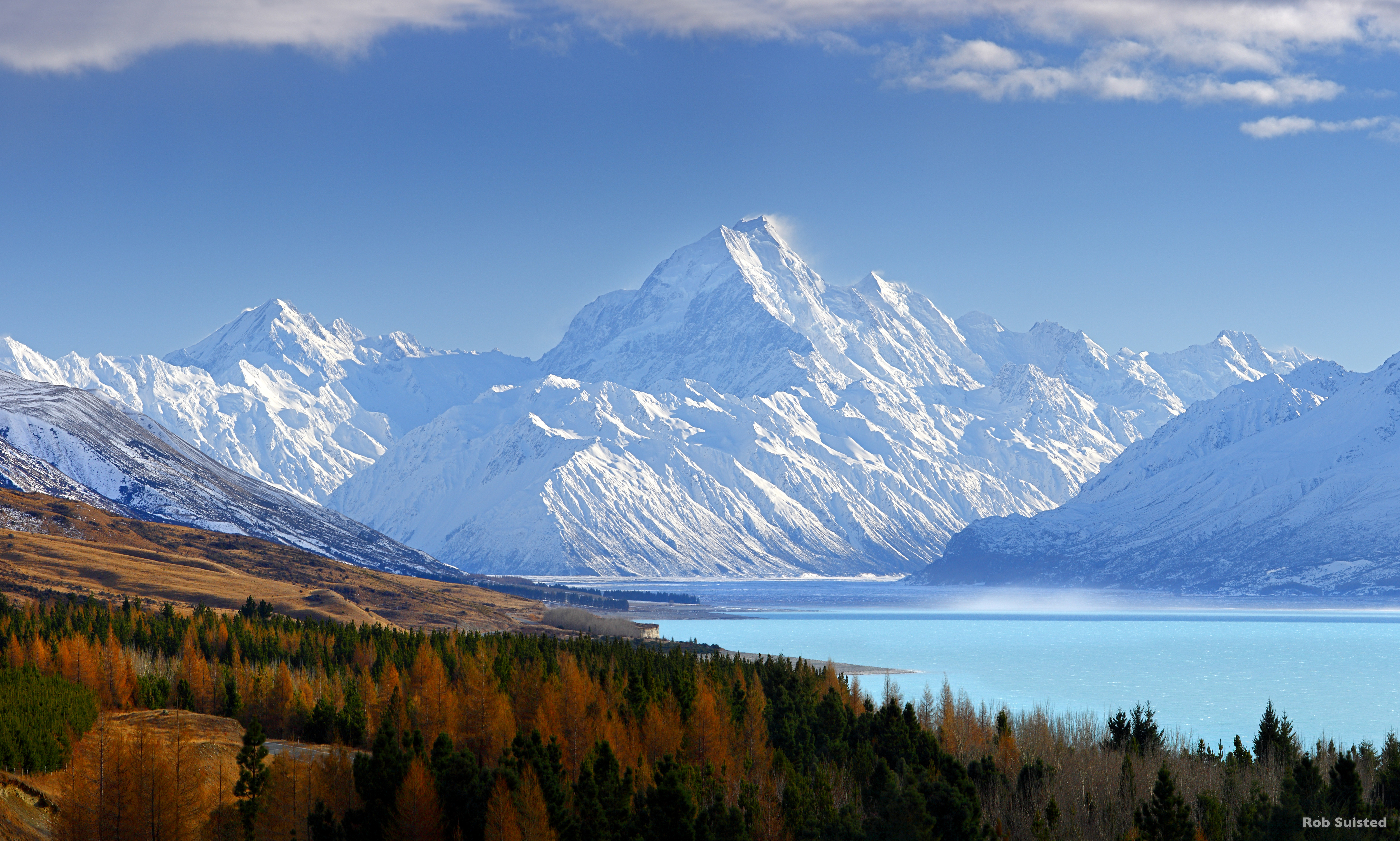 38773AM00: Aoraki / Mount Cook (3754m) and Lake Pukaki in winter. Mt La Perouse (3078m) left, Tasman Valley and Burnett Mountains Range right. Panorama with late autumn colours, Aoraki / Mount Cook National Park, MacKenzie District, New Zealand. Photocred